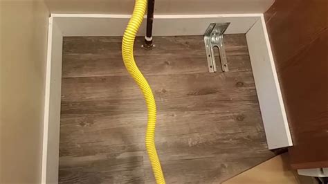 is it safe to lay laminte under a gas stove